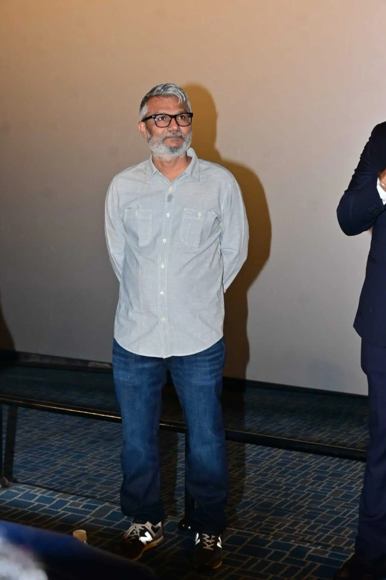 Director Nitesh Tiwari attended the teaser launch dressed in a simple grey shirt paired with dark blue jeans, and a pair of sneakers.